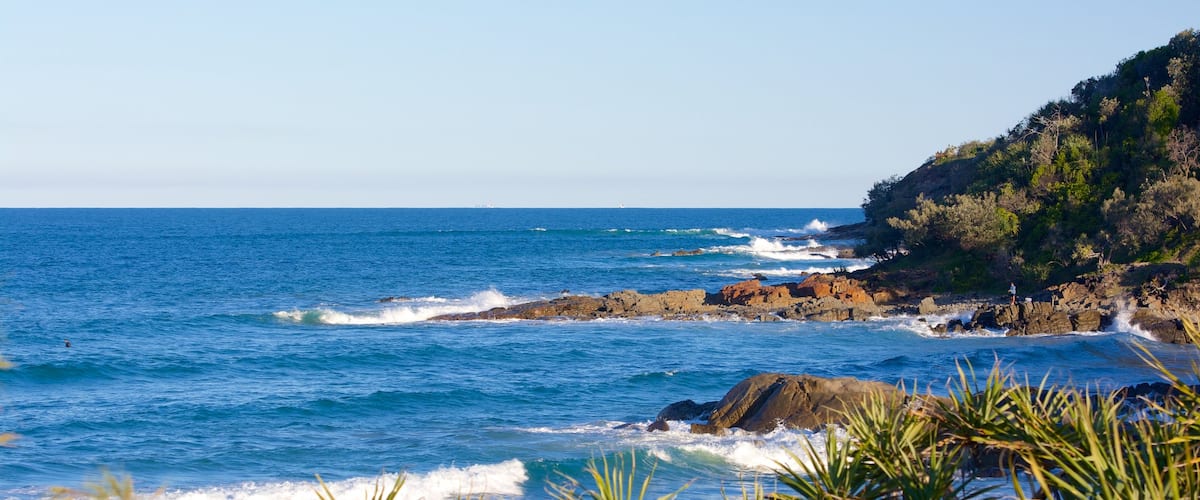 Coolum Beach which includes rugged coastline
