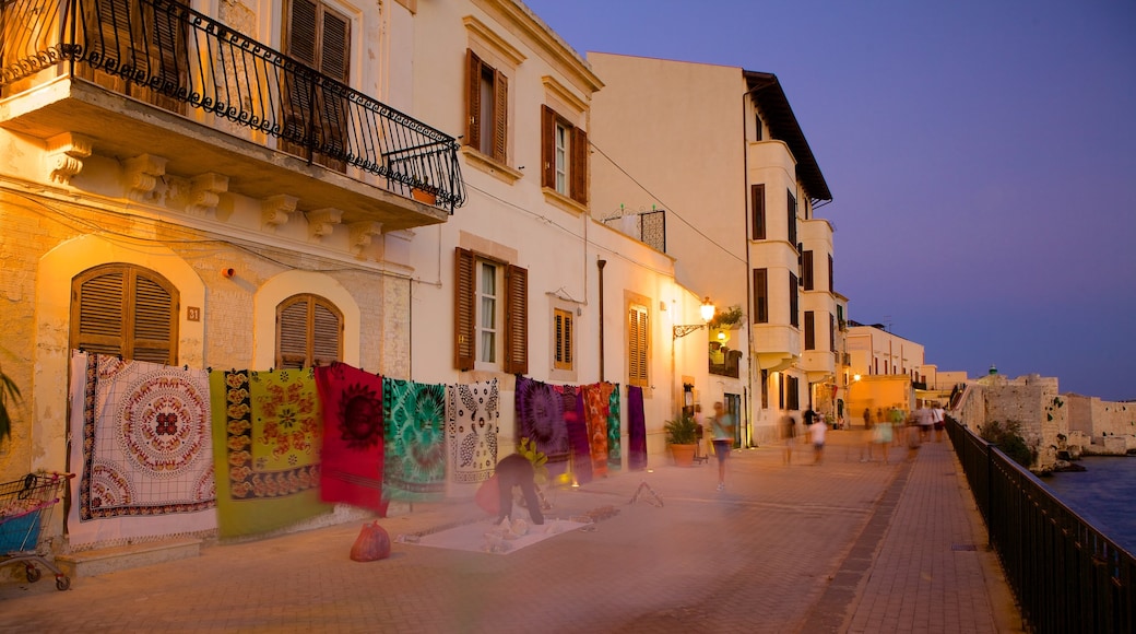 Ortygia showing a sunset, night scenes and a coastal town