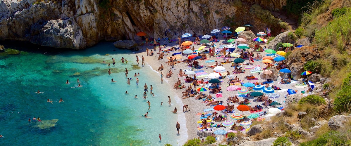 Zingaro Beach featuring swimming, a beach and a bay or harbor