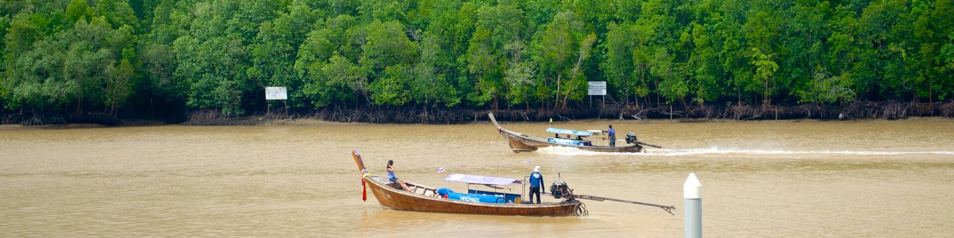 Downtown Krabi showing boating and a river or creek
