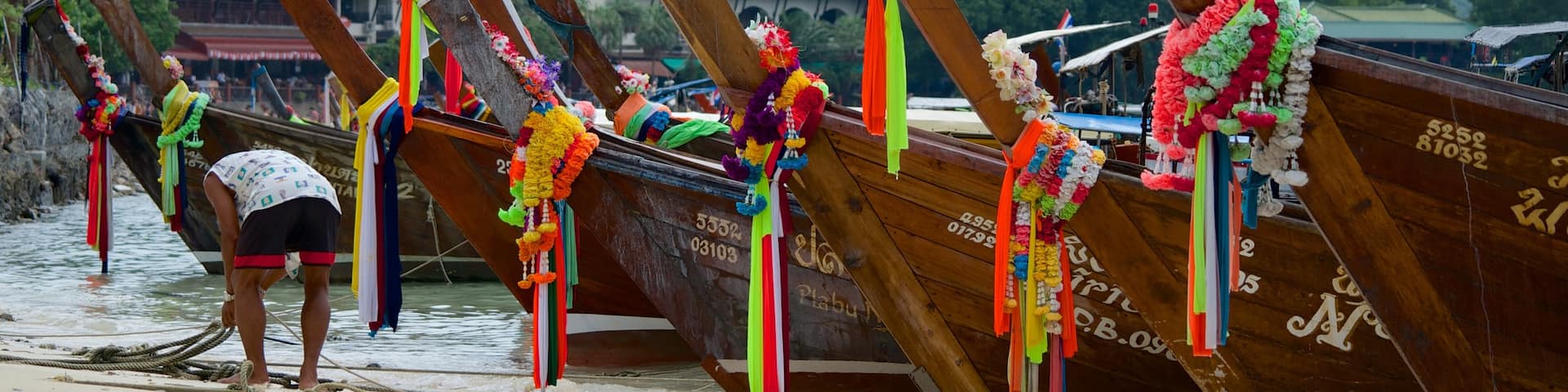 Ao Ton Sai Beach which includes a bay or harbor, boating and religious elements