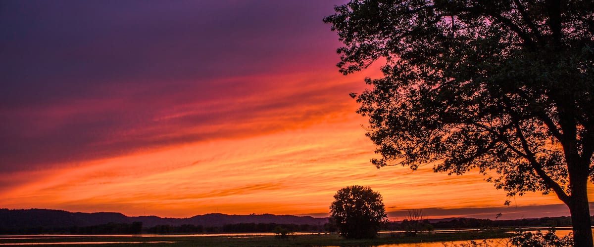 La Crosse showing a sunset and a lake or waterhole