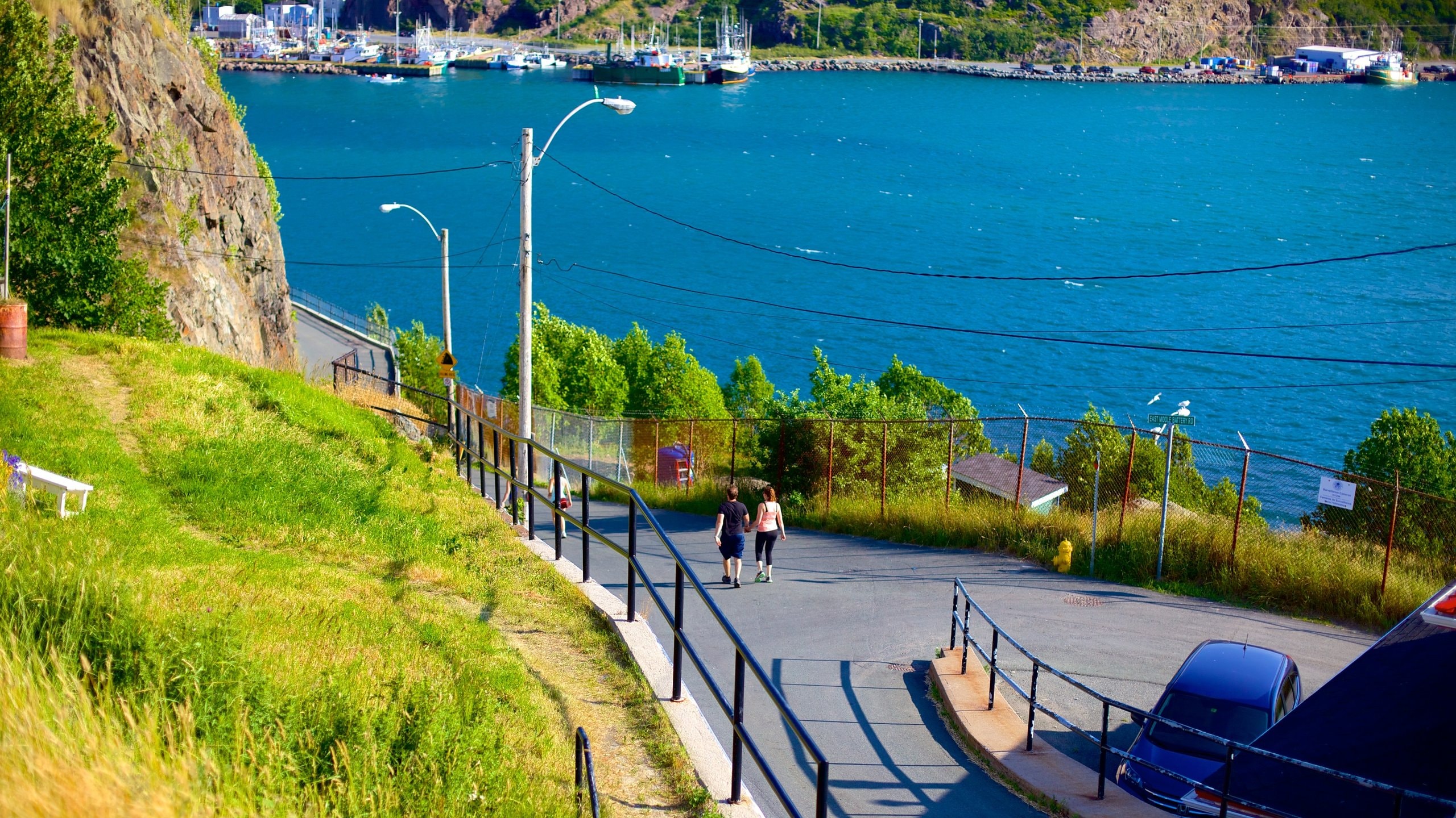 San Juan de Terranova ofreciendo vistas generales de la costa y senderismo o caminata y también una pareja