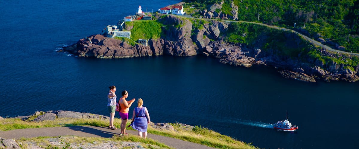 Signal Hill showing general coastal views as well as a small group of people