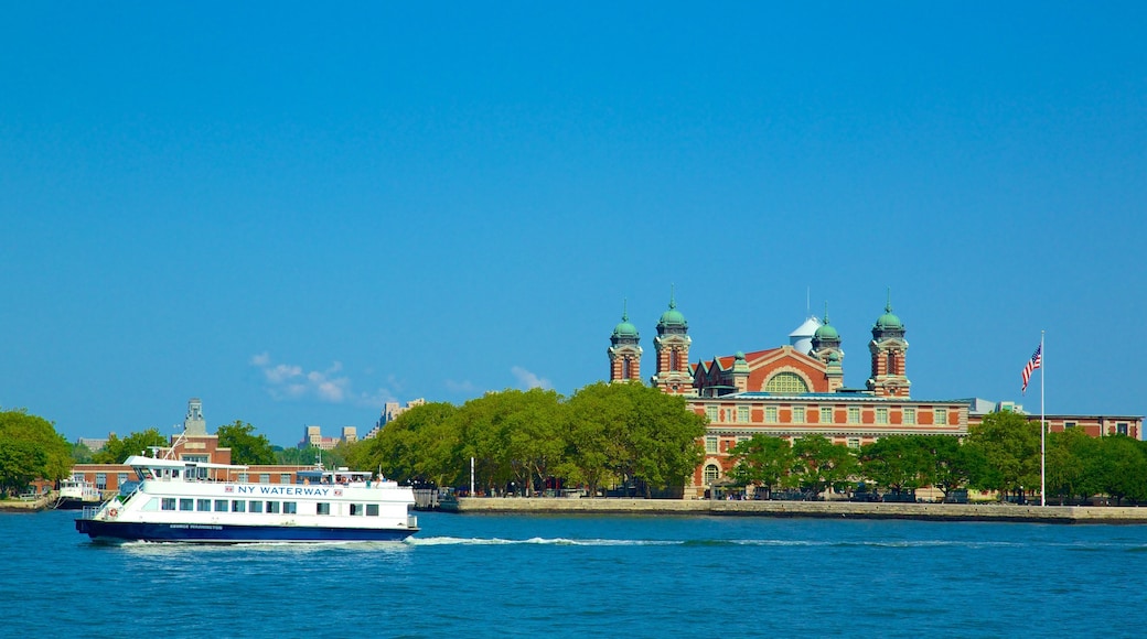 Ellis Island showing general coastal views and a ferry