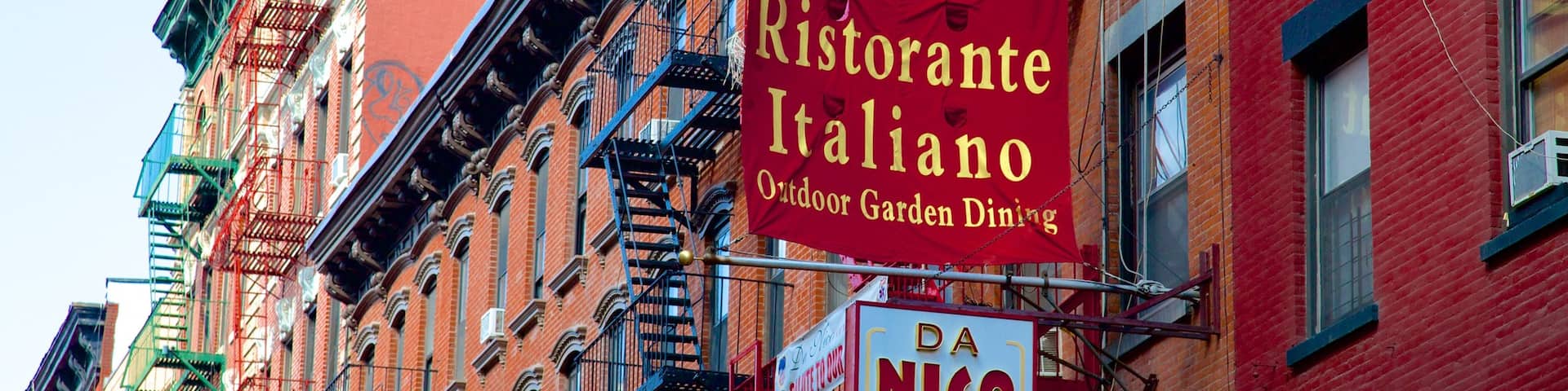 Little Italy featuring signage and a city