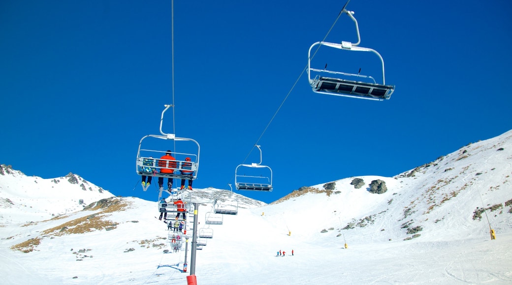 The Remarkables Ski Area which includes snow and a gondola as well as a small group of people