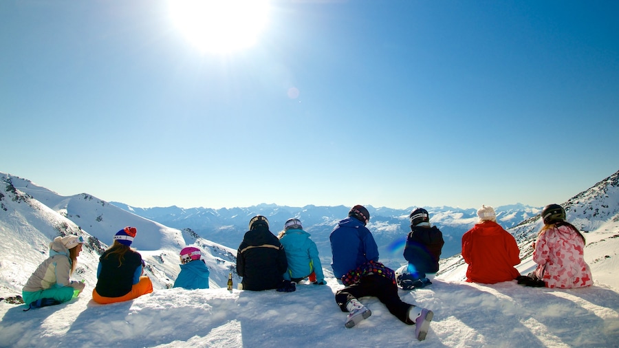 The Remarkables Ski Area showing snow as well as a small group of people
