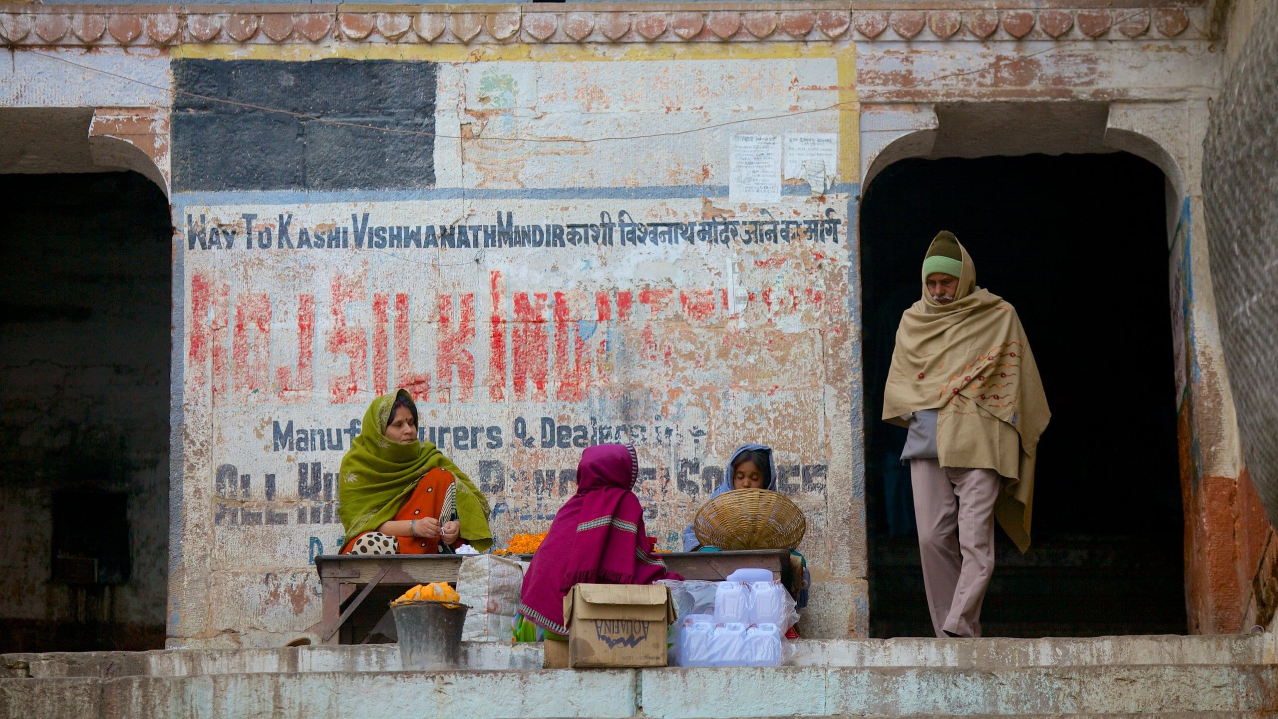 Varanasi showing signage as well as a small group of people
