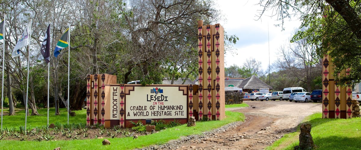 Lesedi Cultural Village which includes a small town or village and signage