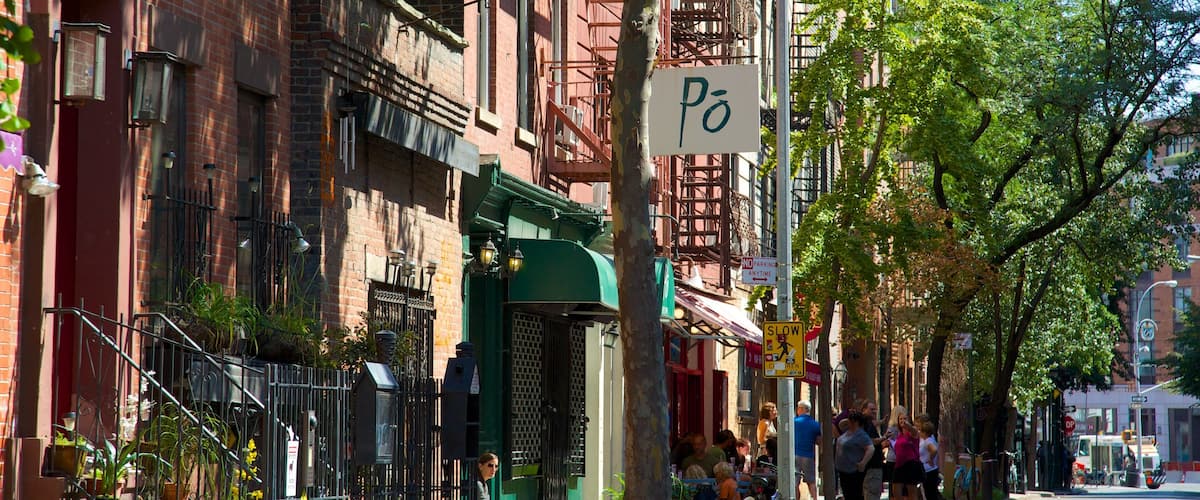 West Village which includes signage, a city and street scenes