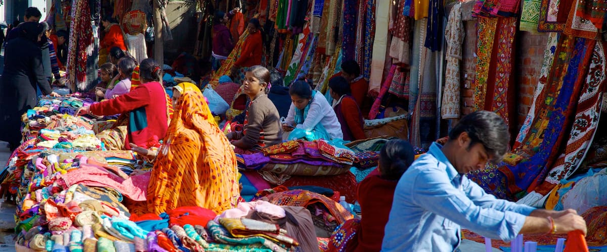 Delhi which includes shopping and markets as well as a small group of people