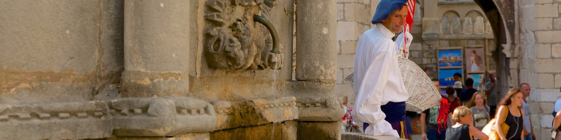 Onofrio\'s Fountain which includes heritage elements and a fountain as well as an individual male