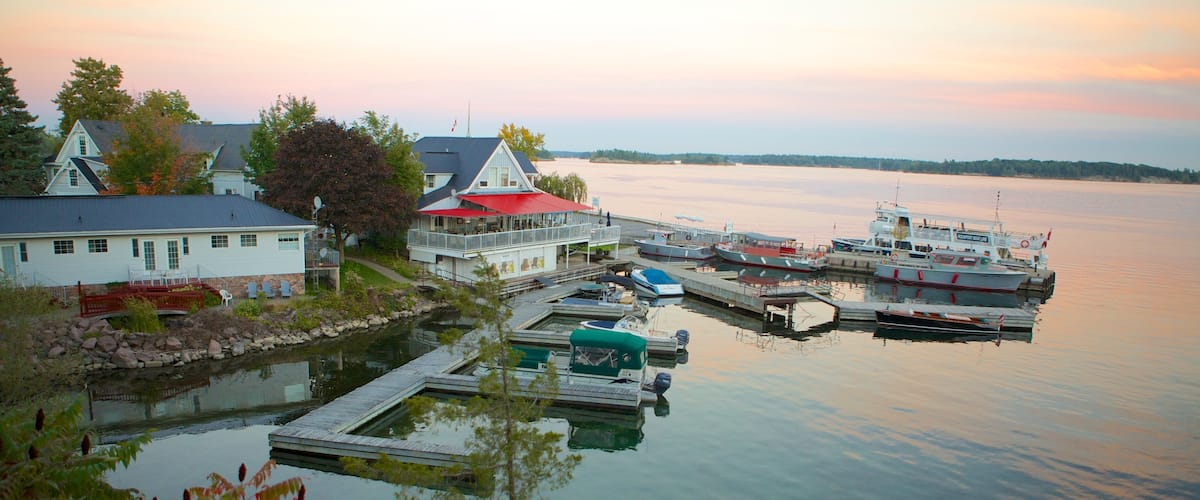 Rockport which includes a lake or waterhole and a sunset