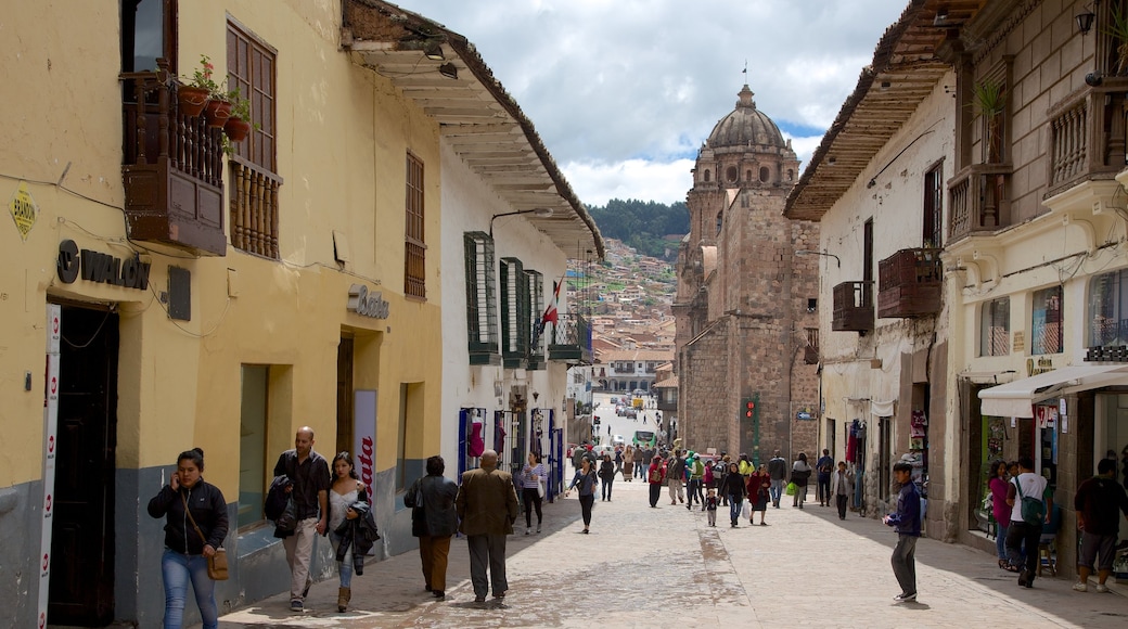Cusco which includes street scenes