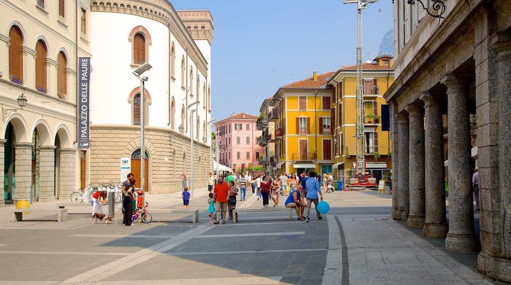 Lecco which includes a city and a square or plaza