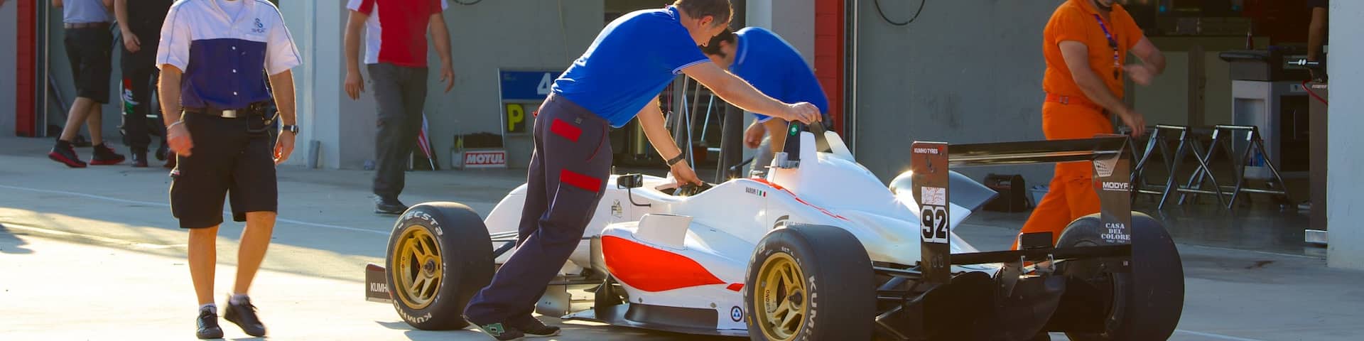Imola showing a sporting event as well as a small group of people