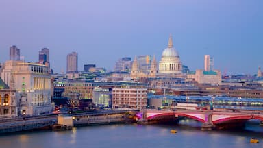 London showing a high-rise building, night scenes and a city