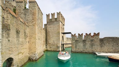 Scaliger Castle featuring vehicle touring, boating and chateau or palace