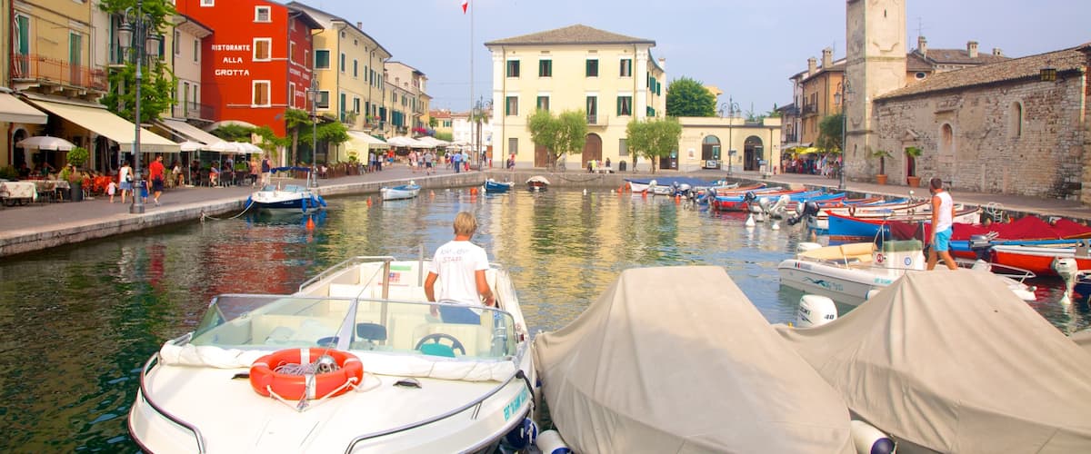 Lazise featuring a river or creek, a marina and a city