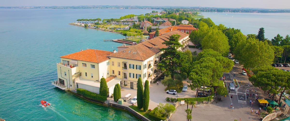 Scaliger Castle which includes a small town or village and a lake or waterhole