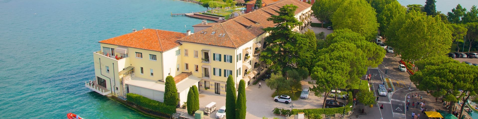 Scaliger Castle which includes a small town or village and a lake or waterhole