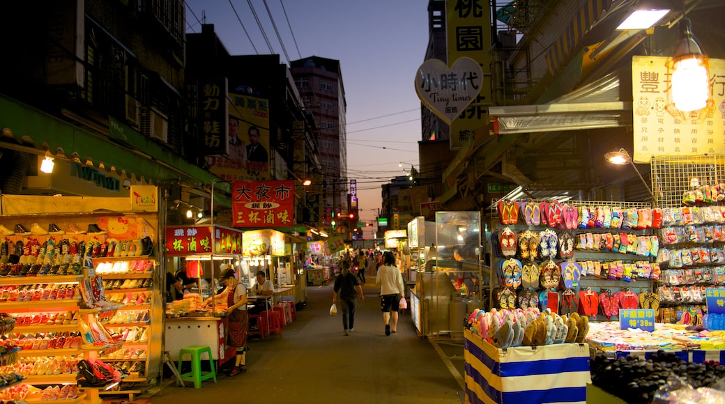 Taoyuan County showing night scenes, markets and a city