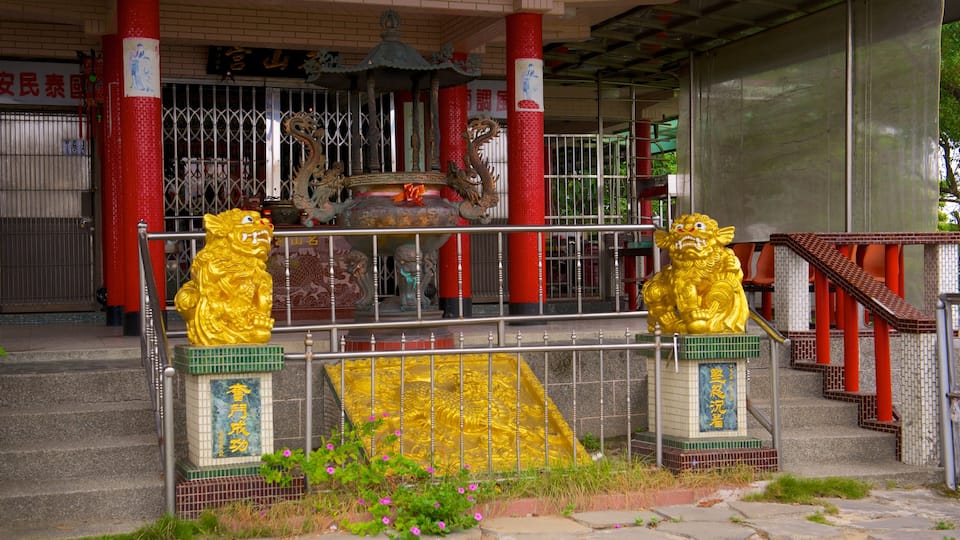 Zhongzheng Park which includes a garden and religious elements
