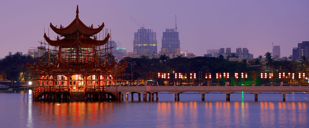 Spring and Autumn Pavillions featuring a sunset, a lake or waterhole and a temple or place of worship