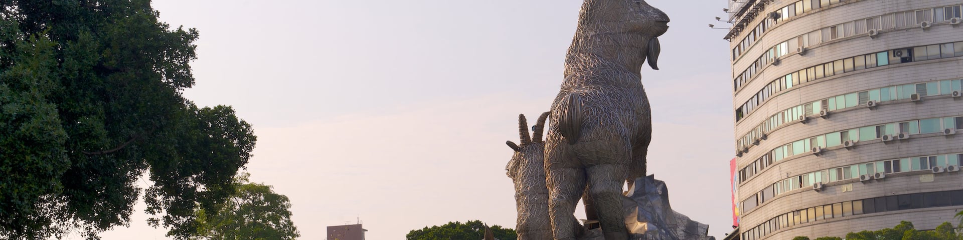 Taichung Park which includes a garden and a statue or sculpture