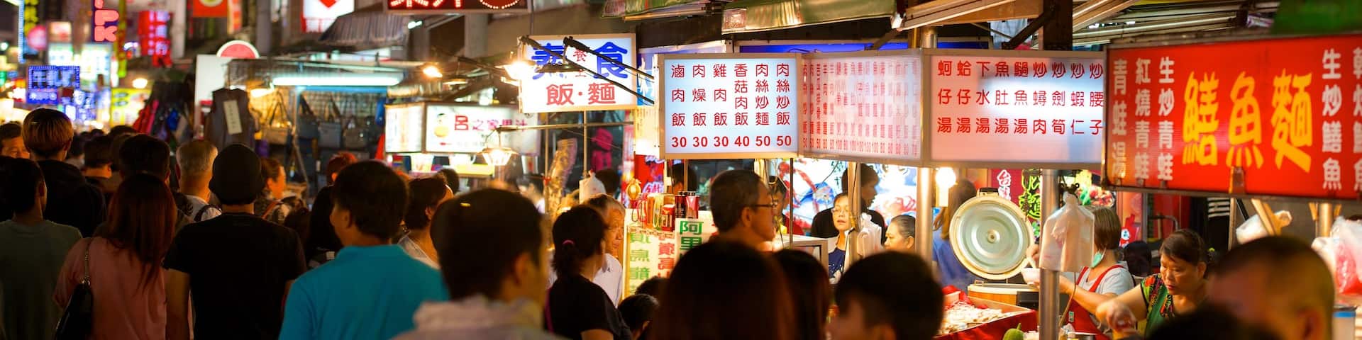 Liuhe Night Market showing a city, night scenes and markets