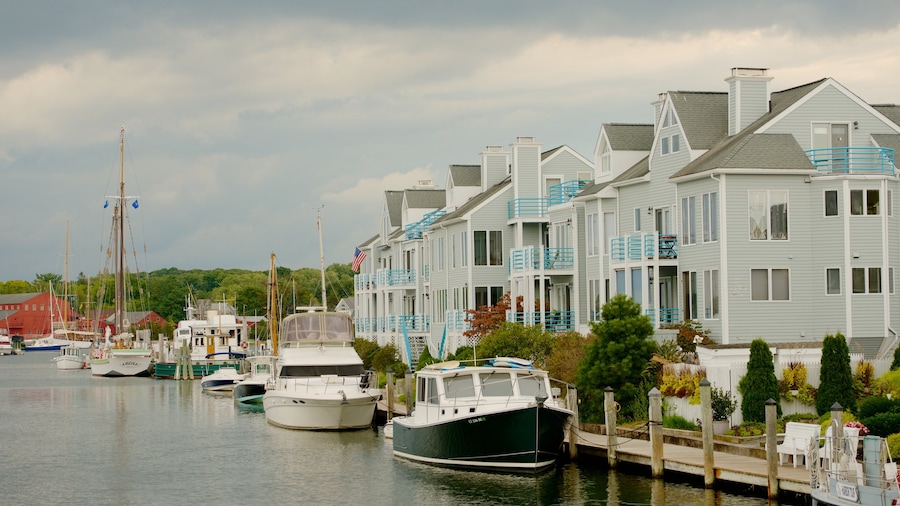 Mystic which includes a house and a bay or harbor