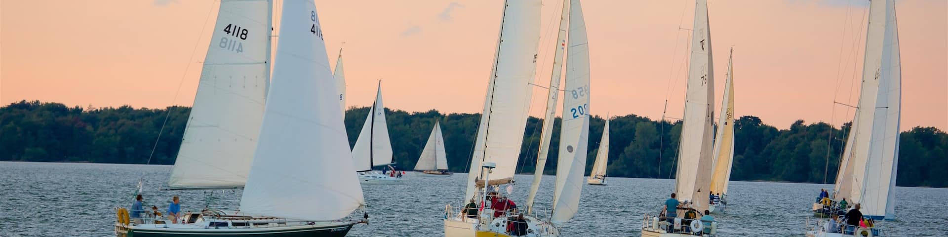 Erie featuring a lake or waterhole, sailing and a sunset