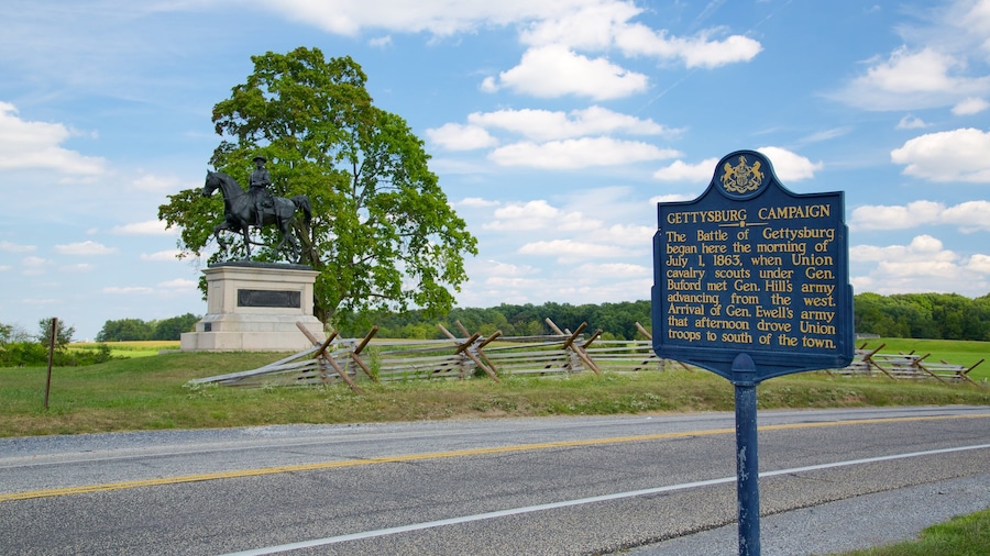 Journey Through Hallowed Ground Byway which includes signage, a statue or sculpture and tranquil scenes