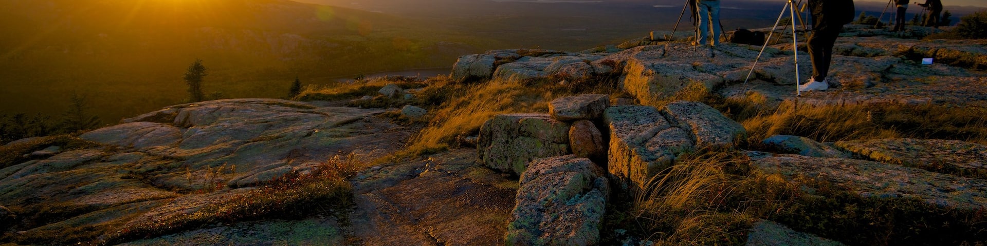 Cadillac Mountain which includes a sunset, landscape views and mountains