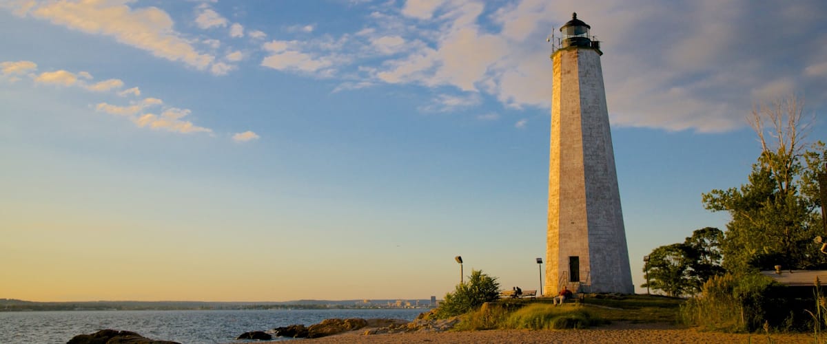 Lighthouse Point Park showing a lighthouse and a sandy beach