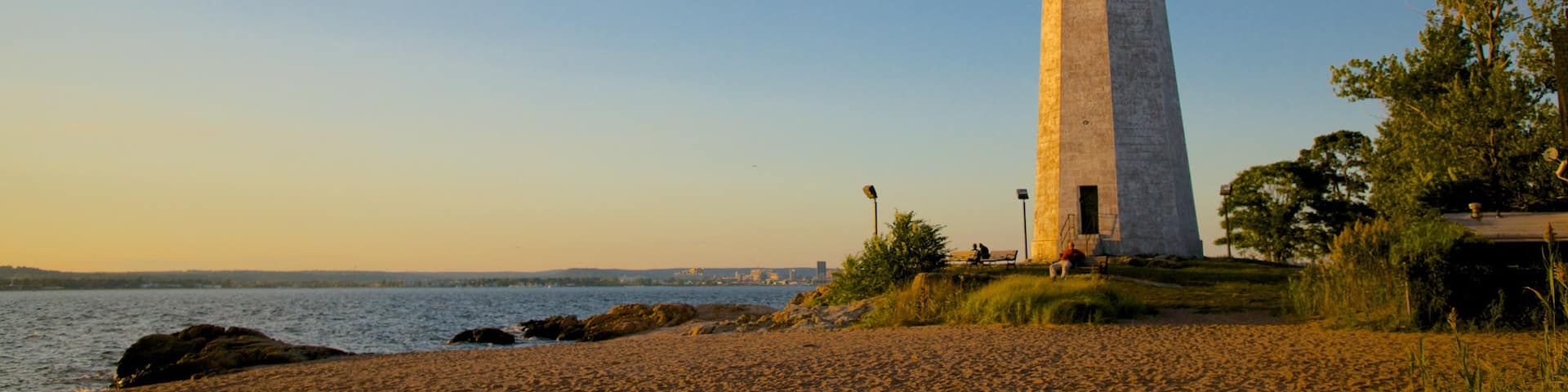 Lighthouse Point Park showing a lighthouse and a sandy beach