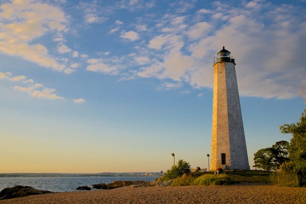 Lighthouse Point Park featuring a lighthouse and a sandy beach