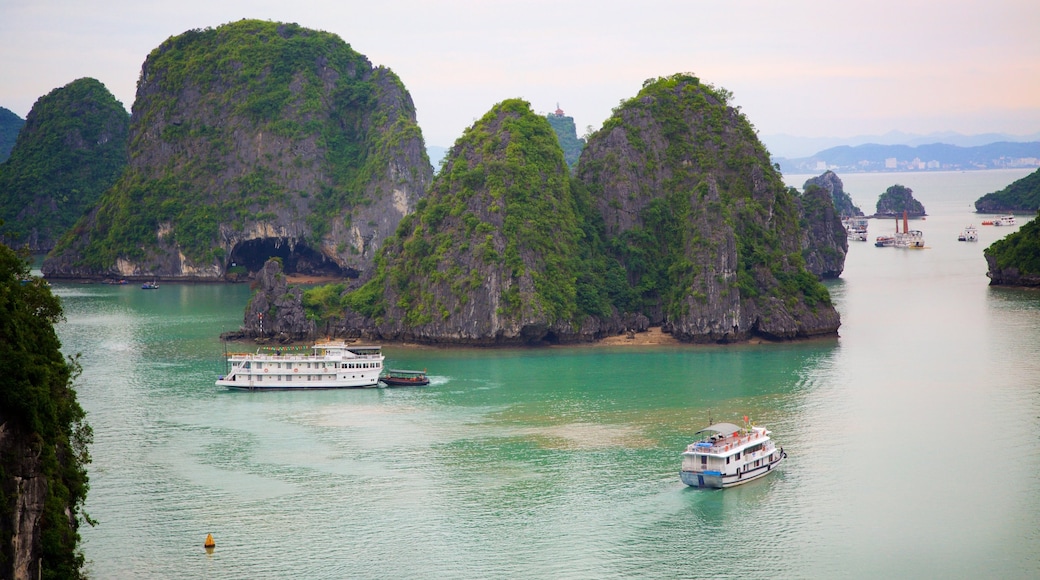Halong Bay which includes a bay or harbour, boating and mountains