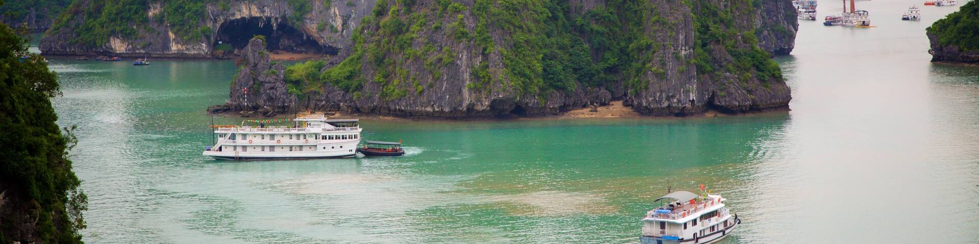 Halong Bay featuring mountains, a bay or harbor and boating