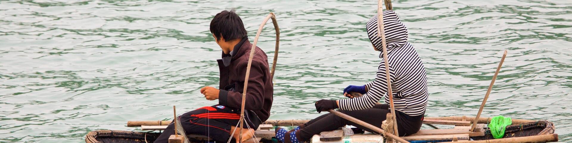Halong Bay showing kayaking or canoeing and a bay or harbor