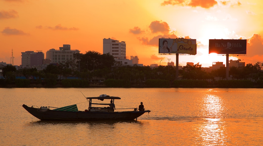 Han River which includes a sunset, signage and general coastal views