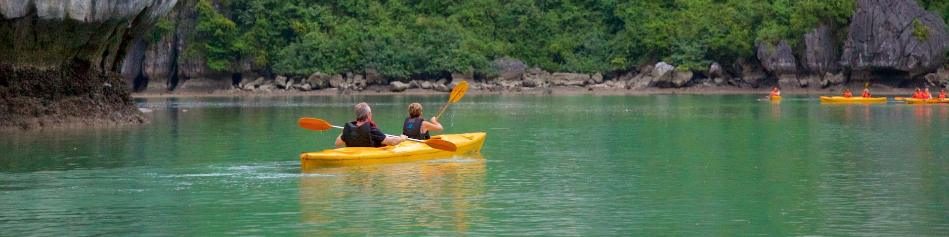 Halong Bay featuring kayaking or canoeing and island images