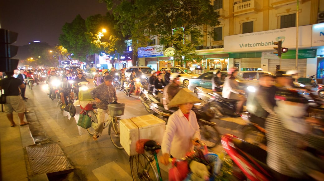 Hanoi which includes motorcycle riding and street scenes