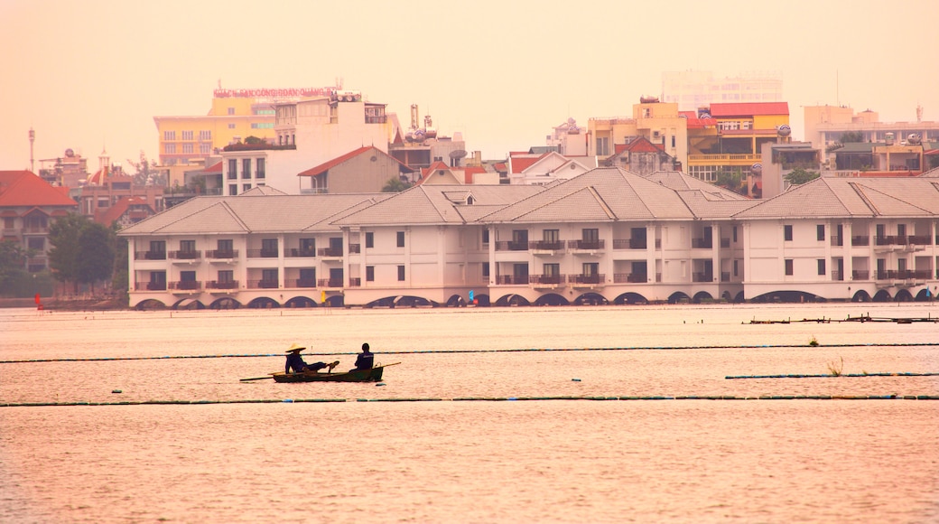 Tay Ho showing kayaking or canoeing and a sunset