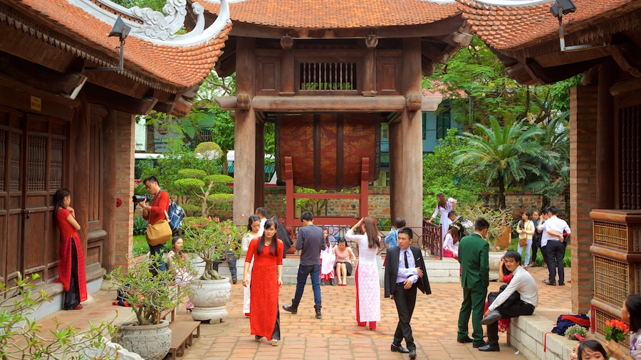 Temple of Literature showing a temple or place of worship as well as a large group of people
