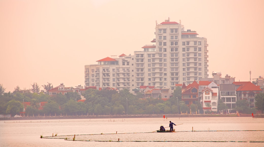 Tay Ho which includes a sunset and a river or creek