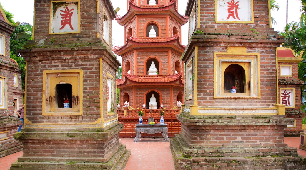 Tran Quoc Pagoda showing a temple or place of worship and religious elements