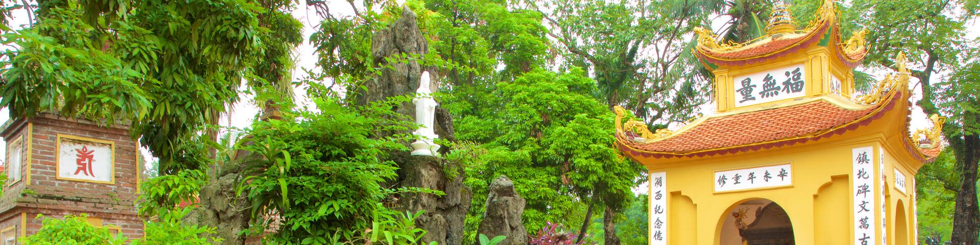 Tran Quoc Pagoda showing a garden, a temple or place of worship and a fountain