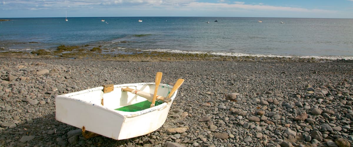 Playa Barca featuring general coastal views, boating and a pebble beach